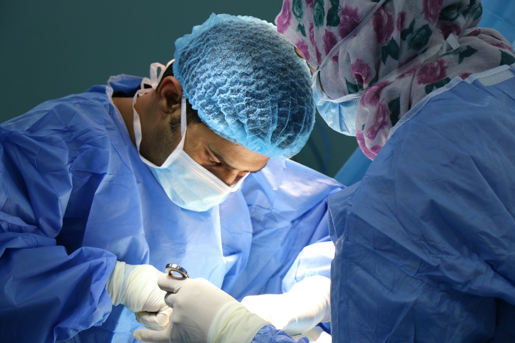 Surgical care team working together in an operating room